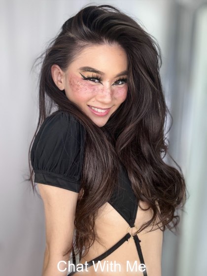 Fun flirty Asian girl with a skimpy little one piece