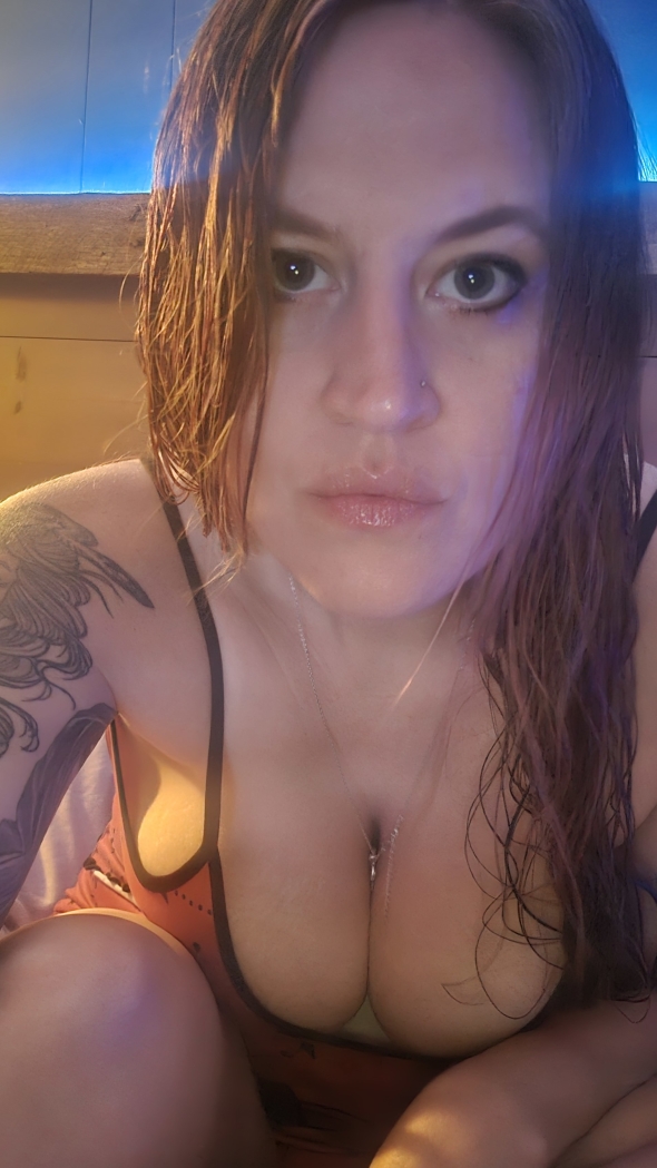 Hair wet and jammies on in bed waiting for you