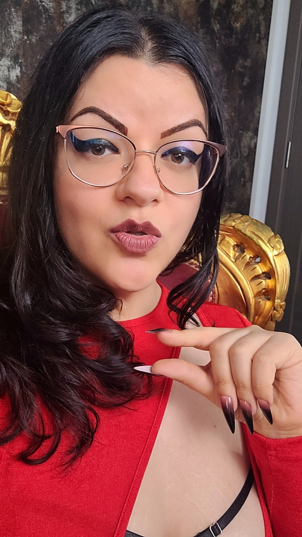 At my feet,  making me laugh on cam with your inny weeny