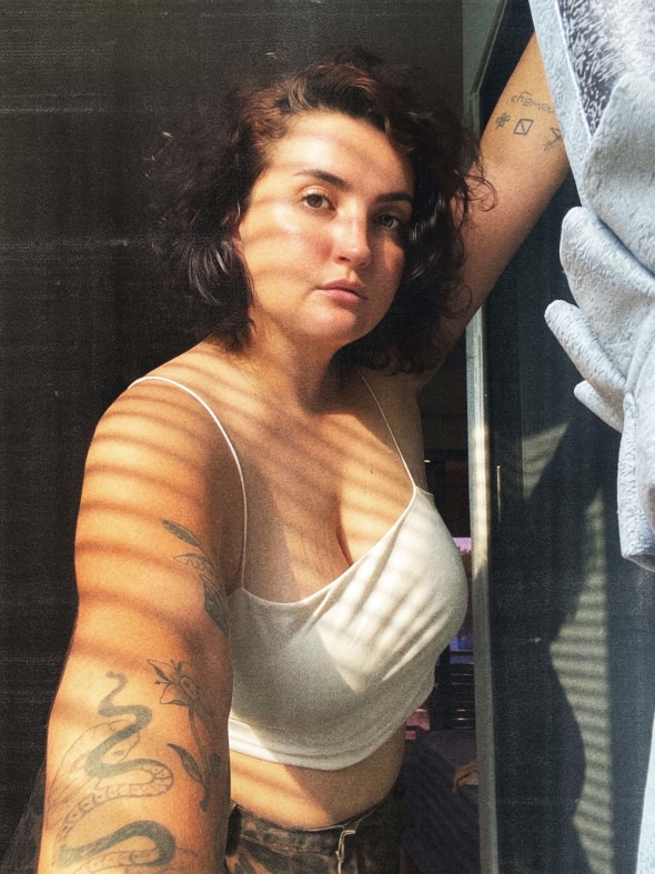 its a selfie in a white top