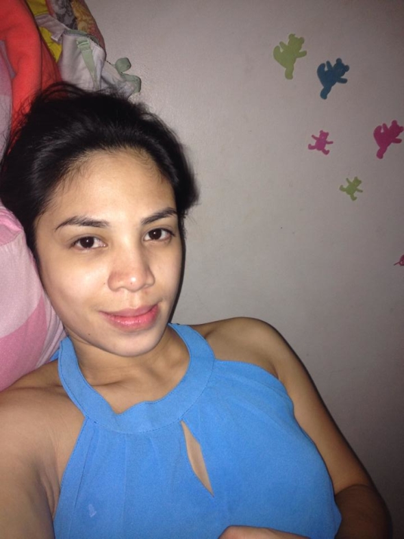 Wearing a soft blue top with a relaxed and confident expression. A simple yet charming upper body moment with natural appeal.